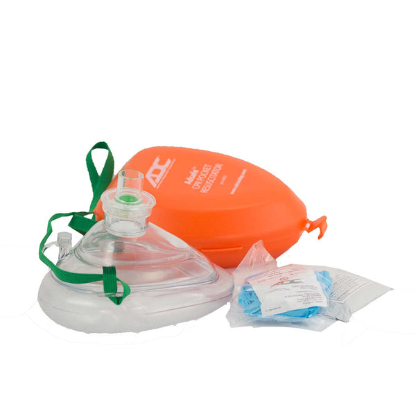 CPR Pocket Mask with clear plastic face shield, orange protective case, green elastic strap, and sealed medical accessories including disposable gloves and alcohol wipe. Complete emergency resuscitation kit for both adult and pediatric use.